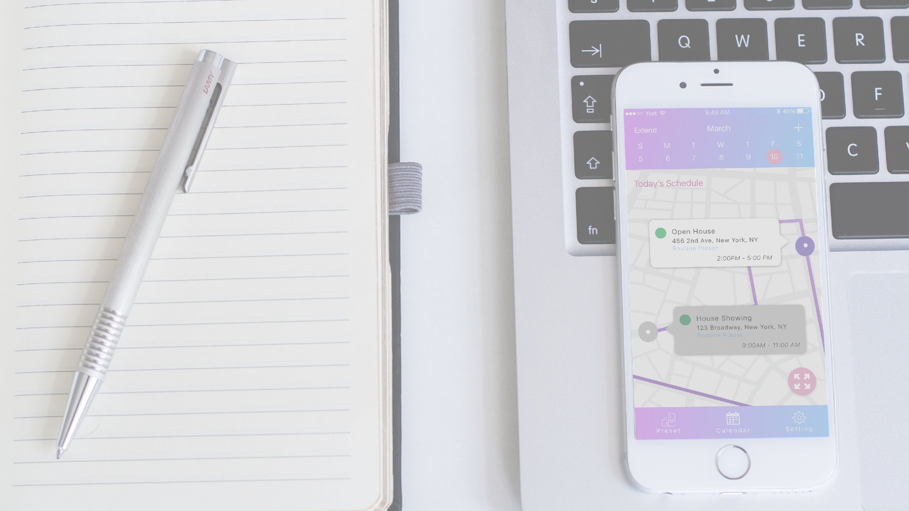 Beacon calendar app route view on a phone beside a notebook